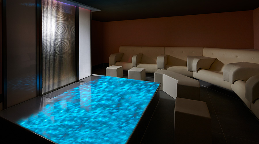 dark experience room with water feature in the middle of the room 