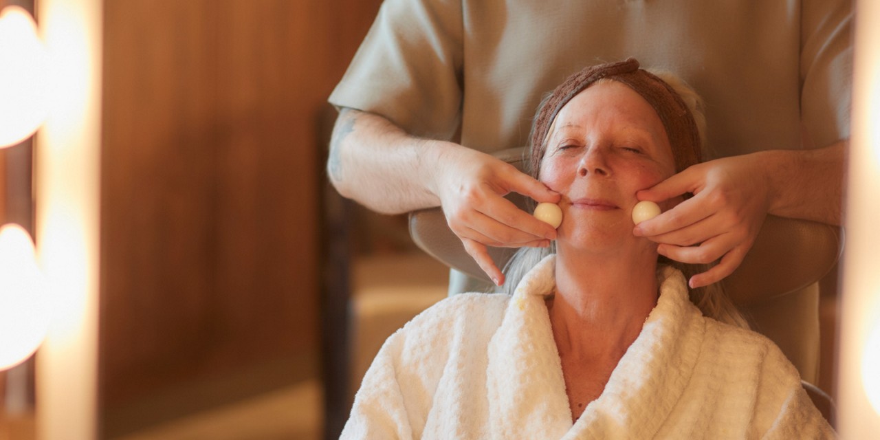 Woman having a relaxing facial treatment.