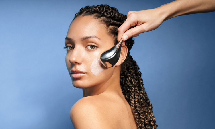Woman having a [ comfort zone ] facial.