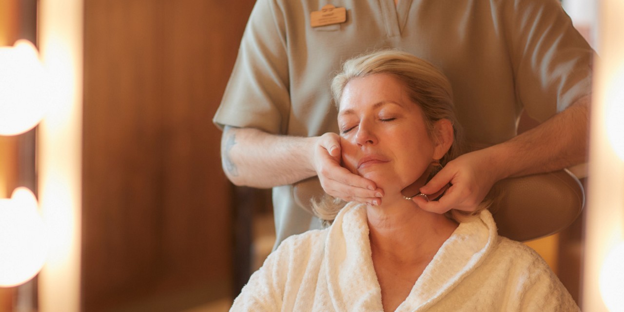 Woman having a relaxing facial massage.
