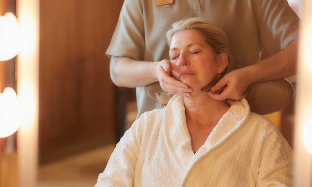 Woman having a sculpting facial massage.