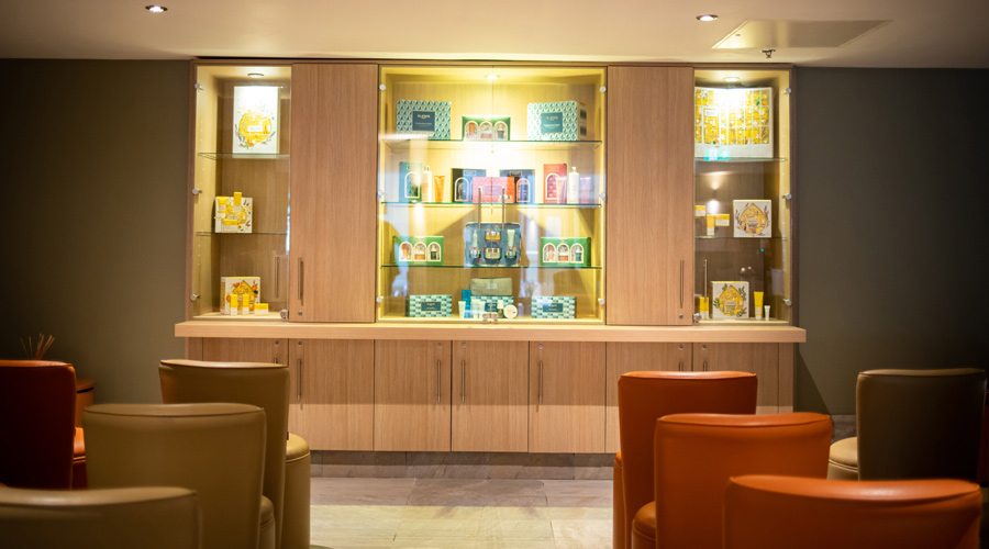 Inside the Spa Discovery room with chairs lined up and products displayed.