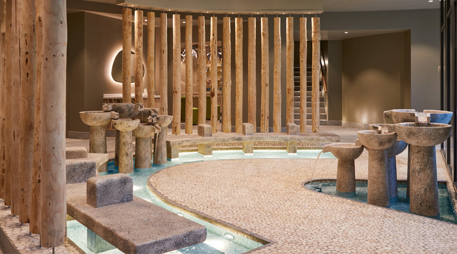 Stone footbaths with water fountain features.