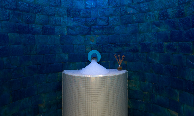 Ice room with a fountain on the wall creating shaved ice.