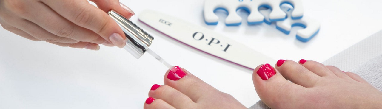 feet with nails being painted