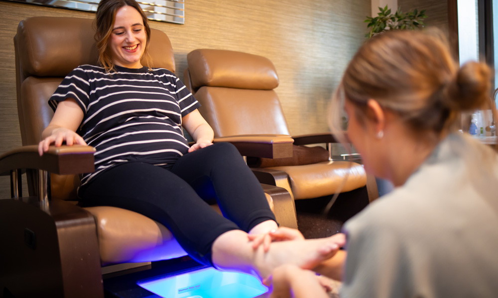 Pregnant woman having a foot massage.