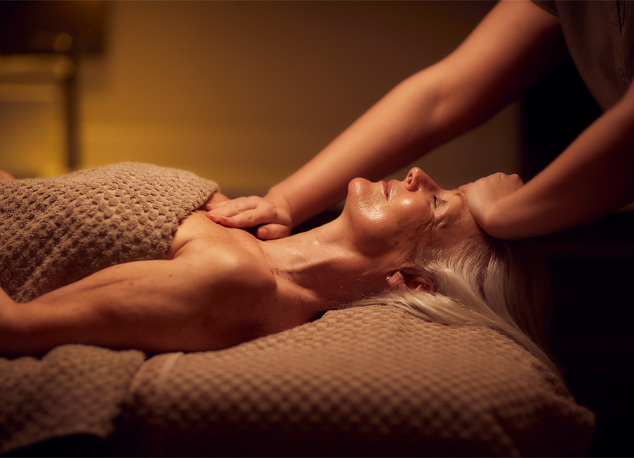 Woman laid back having a relaxing facial.