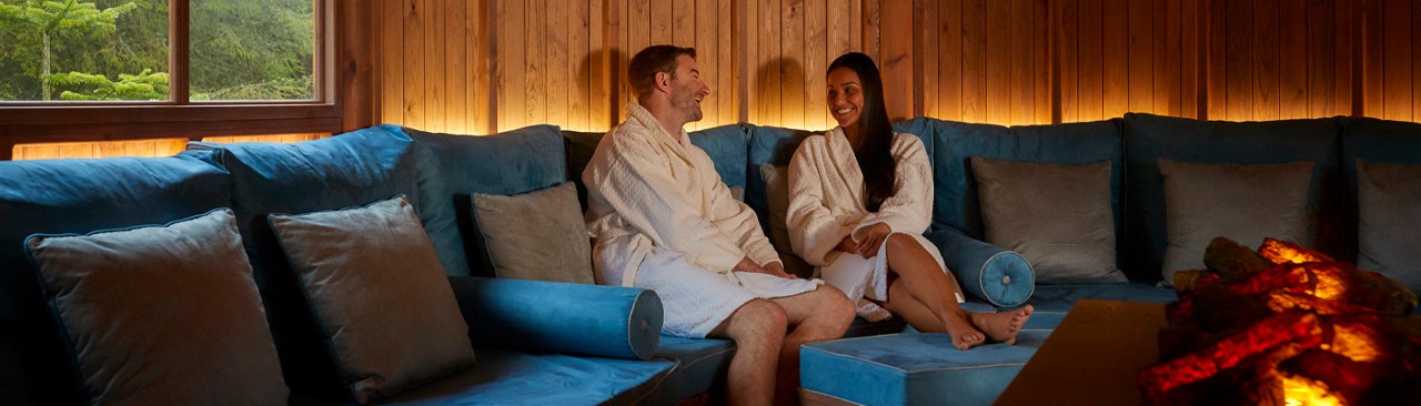 A mum and daughter in the sauna.