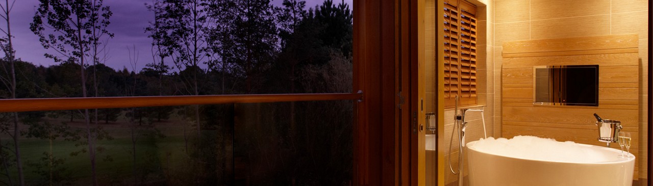 bathtub next to balcony 