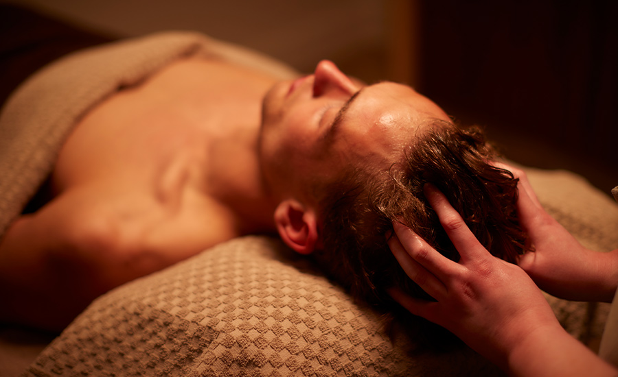 Man having a relaxing scalp massage.