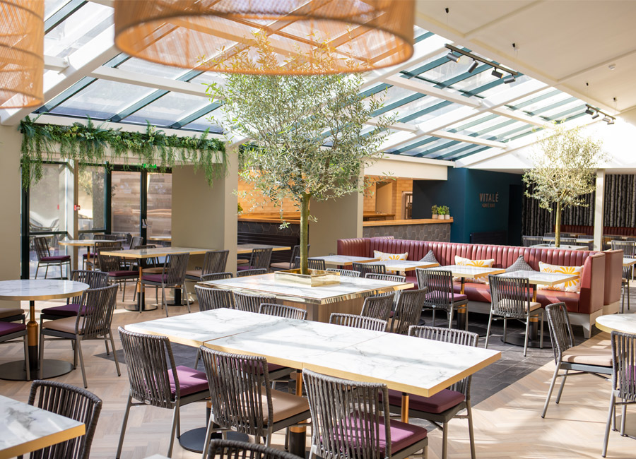 vitale seating area with tables and chairs