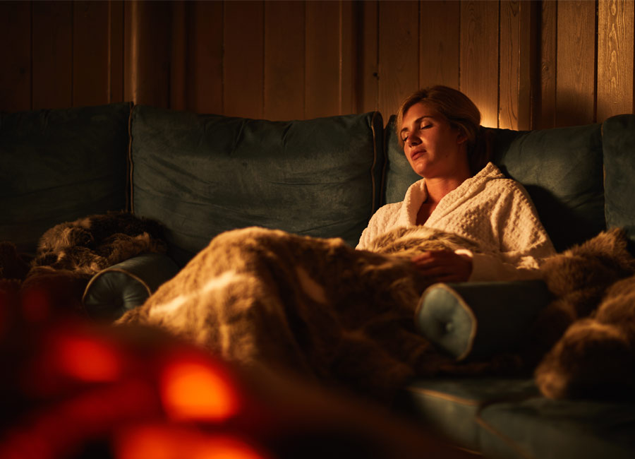 woman asleep in snug experience room 